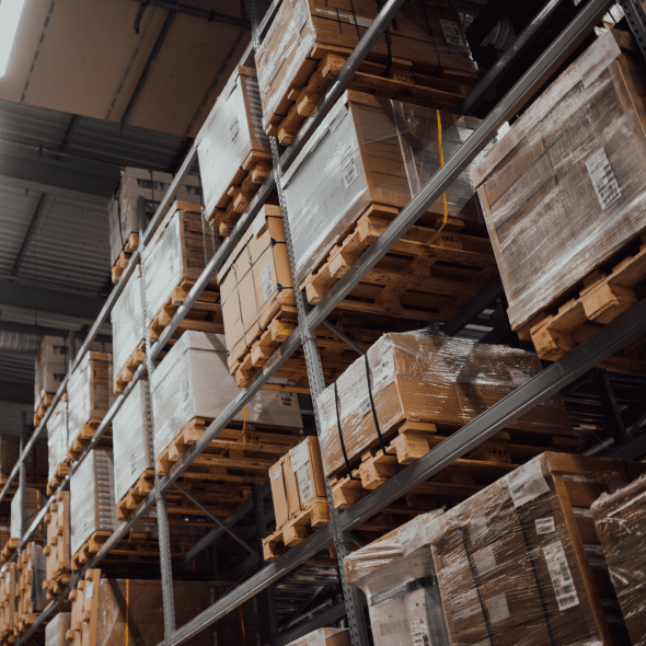 Cardboard boxes on shelves in warehouse